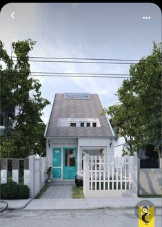 a small white house with a blue front door and fenced in area next to it