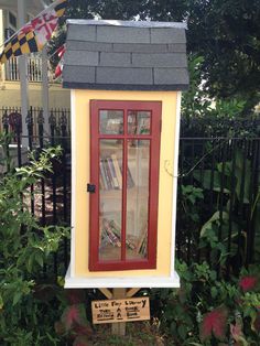 a little library in the middle of some bushes