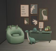 a green dinosaur chair sitting next to a dresser in a room with pictures on the wall