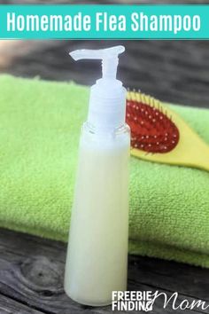 a bottle of homemade flea shampoo sitting on top of a green towel