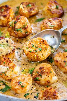 a pan filled with shrimp and potatoes covered in gravy, garnished with parsley