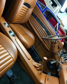 the interior of a car with tan leather