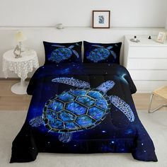 a bed room with a neatly made bed and a night sky scene featuring a sea turtle