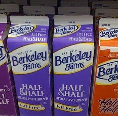 three boxes of berkley farms half and half milk are on display for sale