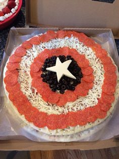 a captain america pizza in a box on a table