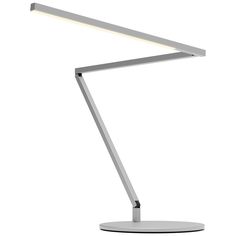 a modern desk lamp with a dim light on the top and one arm folded open