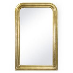 a gold framed mirror on a white wall