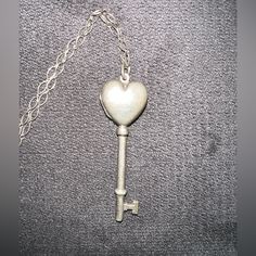 Tiffany & Co Rare Silver Heart Key Locket Pendant With Original Tiffany Chain. Authentic Tiffany & Co Necklace Sterling Silver 925 Marked- Tiffany & Co. 925 Italy Heart Shaped Key Pendant With A Locket, Blue Tiffany Paper Still Inside Locket. Gently Used. Condition As Seen In Photos- Some Signs Of Wear. Minor Exterior Scratches From Wear. Circa 2010. Smoke Free Home. Open To Offers Key Locket, Tiffany And Co Necklace, Locket Pendant Necklace, Heart Key, Heart And Key, Tiffany Co Jewelry, Key Pendant, Silver Heart, Tiffany & Co.