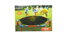 an inflatable trampoline game set with people running on the grass behind it