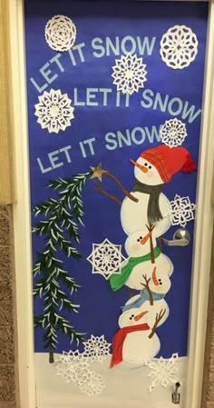 a door decorated to look like a snowman with the words let it snow on it