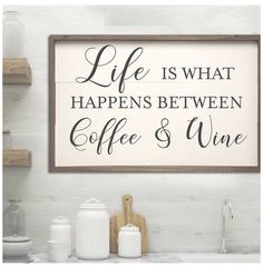 a framed sign that says life is what happens between coffee and wine on the wall