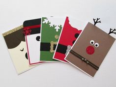 four christmas cards with reindeer noses and nose on them