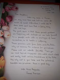 a handwritten letter with tulips on it and an image of flowers in the background