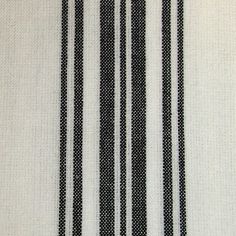 black and white striped fabric with small dots on it's edges, as well as vertical stripes