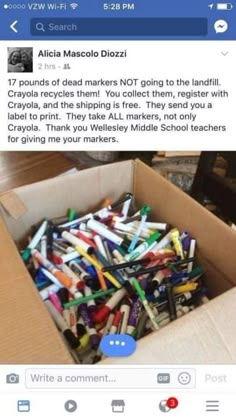 a box full of crayons sitting on top of a table