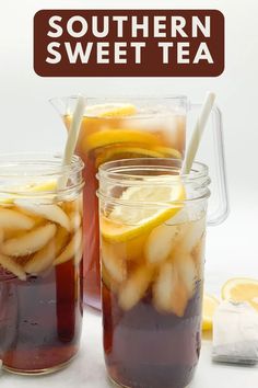 two mason jars filled with iced tea and lemon slices