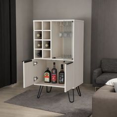 an entertainment center with wine glasses and liquor bottles