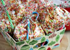 a box filled with lots of candy covered in sprinkles