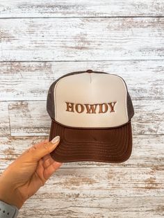 Howdy neutral trucker hat Brown Trucker Baseball Cap With Letter Print, Brown Trucker Hat With Letter Print And Flat Brim, Adjustable Brown Trucker Hat With Letter Print, Brown Adjustable Trucker Hat With Letter Print, Brown Trucker Hat With Letter Print, Western Brown Trucker Hat One Size, Brown Trucker Hat One Size Fits Most, Western Brown Trucker Hat, Brown Western Trucker Hat