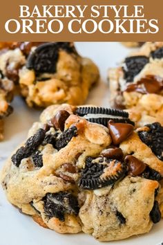 an oreo cookie with chocolate chips and cookies in the middle on a white plate