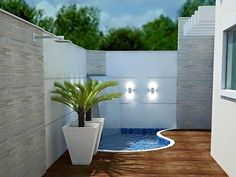 a pool with a plant in it next to a wall and some lights on the side