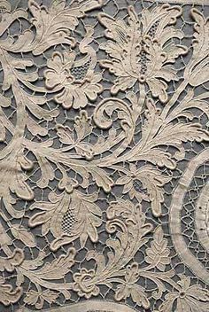 an intricately carved wall panel with flowers and leaves