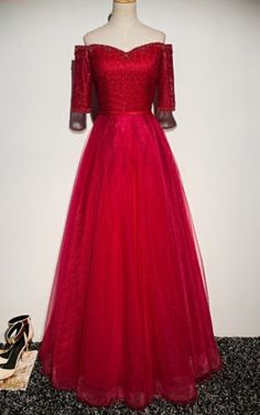 A red evening dress at a formal dress Wedding Gown A Line, Beaded Party Dress, Gowns Dresses Elegant, Formal Ball Gown, Red Evening Dress, Evening Gown Dresses, Lace Evening Dresses, Evening Party Dress, Evening Gowns Formal