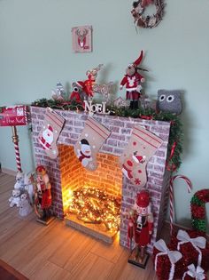 a fireplace decorated for christmas with stockings and decorations