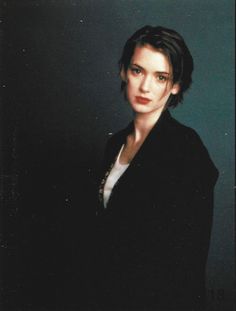 a woman in black jacket posing for a photo