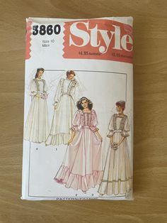 an old fashion sewing pattern on a wooden table