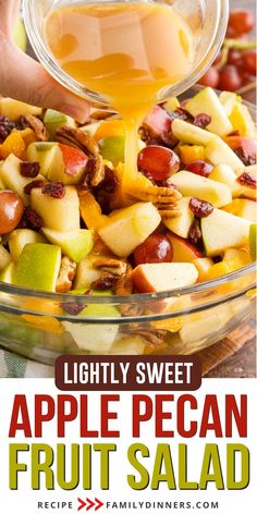 an apple pecan fruit salad is being served in a glass bowl