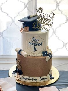 there is a cake that has been decorated with graduation caps and diplomas on it