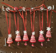 red and white christmas decorations hanging on a wall