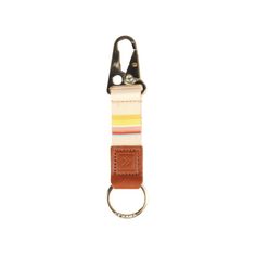 a keychain with an orange, yellow and white stripe on it