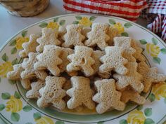 a plate full of cut up cookies on a table