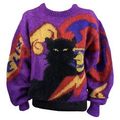 Charming and collectable Krizia Felix black cat oversized signature pullover crewneck sweater in soft knit blend. "Felix" the cats name is knitted into right sleeve. 1980's Italy. Size 42. Excellent Condition, Angora 20%.Mohair 70%,Polyester 10% Length 24", Hem 26" Shoulder 6", Sleeve 26" 90s Style Purple Fall Sweater, 90s Style Purple Sweater For Fall, Cats Name, 1990 Style, Angora Sweater, Graphic Sweaters, Sweater Dresses, Oversize Knit, Cool Sweaters