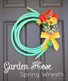 the facebook page for garden hose shows an image of a flower arrangement in front of a door