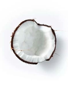 a half eaten coconut on a white background