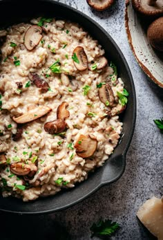 mushroom riso with parsley in a skillet