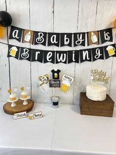 a baby is brewing party with cake and decorations