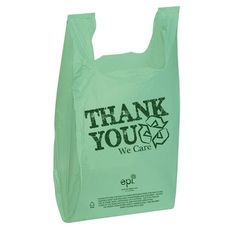 a green plastic bag with the words thank you we care printed on it's side