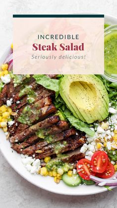 steak salad with avocado, corn and tomatoes on the side in a white bowl