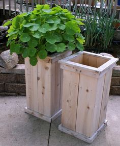 two wooden planters sitting next to each other