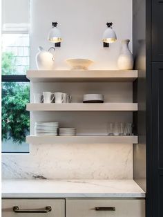 the kitchen counter is clean and ready for us to use it's marble top