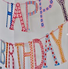 a birthday banner with the words trouva on it and an image of a happy birthday bunting