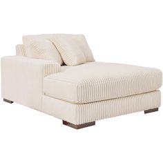 a white chaise lounge chair with two pillows on the back and one arm extended