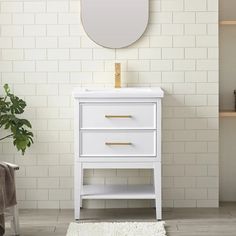 a white bathroom vanity with a round mirror on the wall above it and a rug in front of it