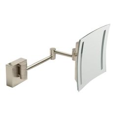 a bathroom mirror mounted to the side of a metal wall mount vanity faucet