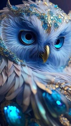 an owl with blue eyes and feathers on it's head is shown in this artistic photo