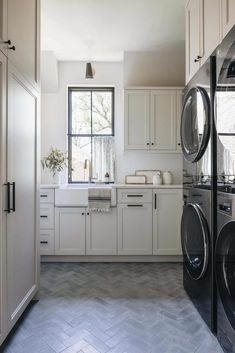 a laundry room with washer and dryer in it